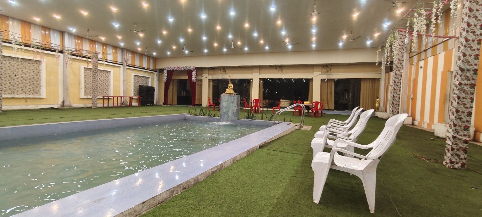 Swimming pool and celebration area at Aamantran Greens Dhanbad